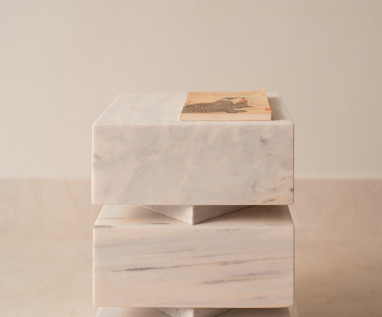Pilas used as a low table, with a book on the stacked modules