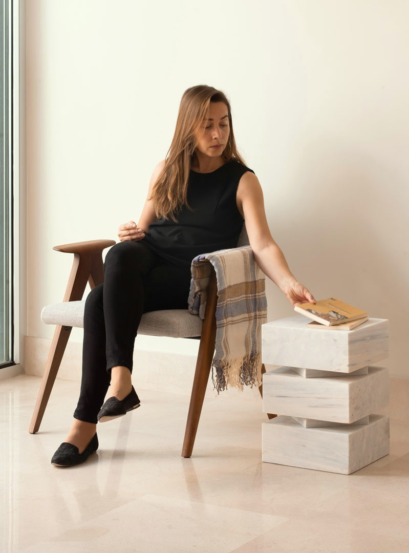Pilas as a side table beside a seated person