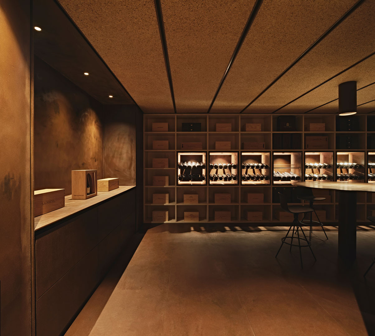 Tinta room with shelving around the perimeter and the table at the far end
